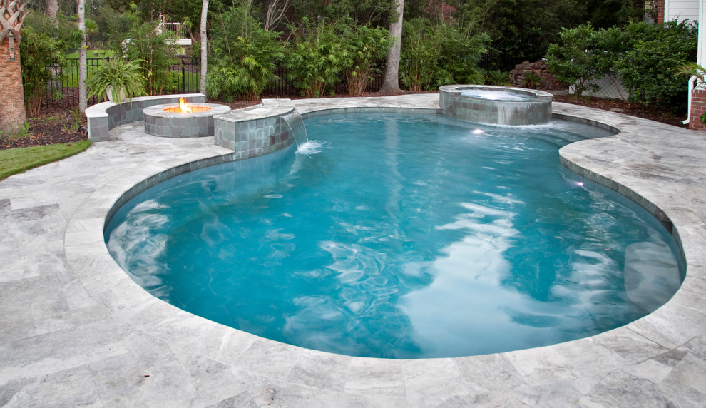 Large elegant backyard custom-shaped hot tub photo in Charleston
