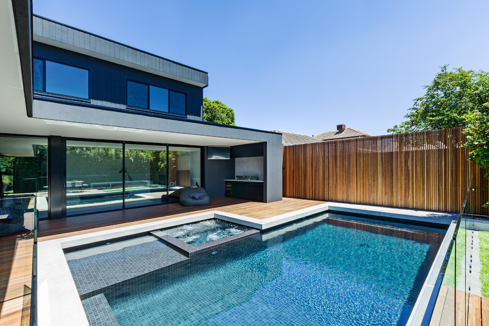 Medium sized modern back swimming pool in Melbourne.