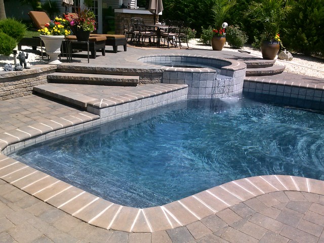 Paver Walkways and Pool Deck with Stone Veneer Retaining Wall ...