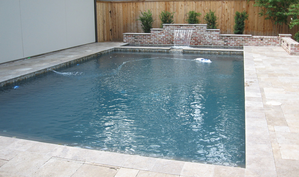 Design ideas for a medium sized classic back rectangular lengths swimming pool in Houston with a water feature and tiled flooring.