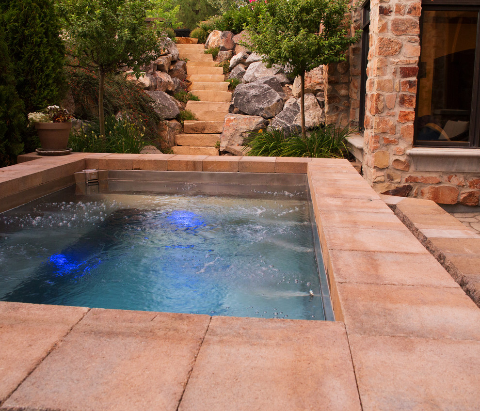 Inspiration for a large timeless concrete paver and rectangular aboveground hot tub remodel in Salt Lake City