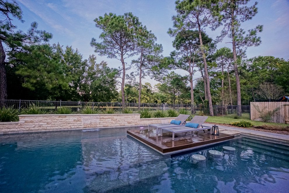 Inspiration for a large retro back rectangular swimming pool in Houston with decking.