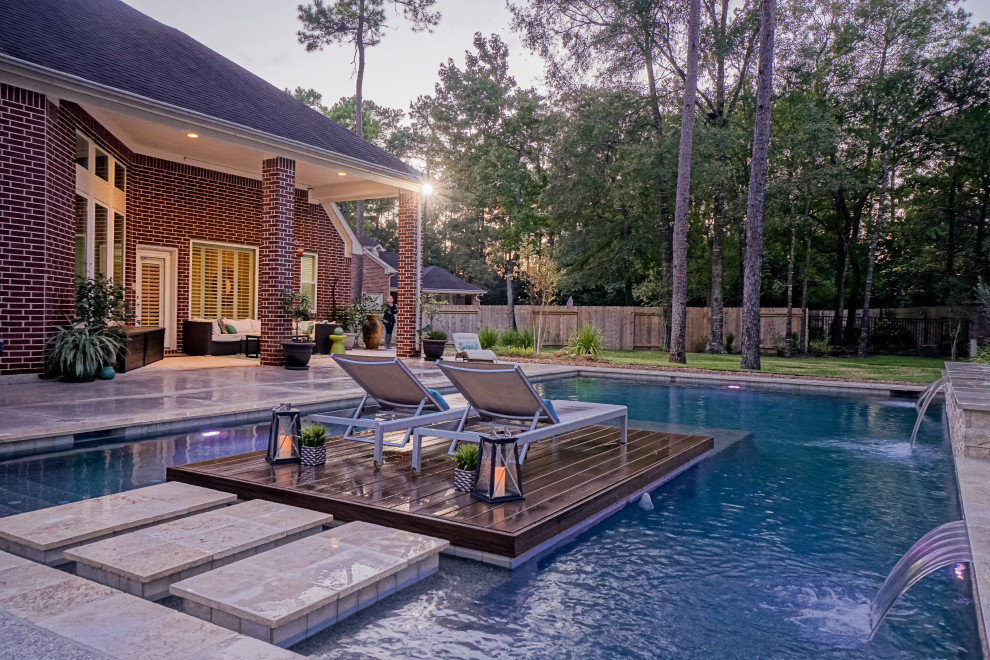 Pool - large 1950s backyard rectangular pool idea in Houston with decking