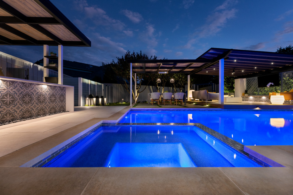 Inspiration for a mid-sized modern backyard rectangular pool remodel in Dallas