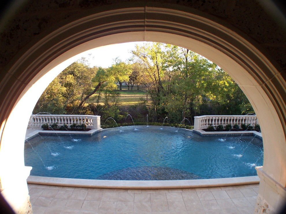 Pool fountain - large mediterranean backyard tile and rectangular infinity pool fountain idea in Dallas
