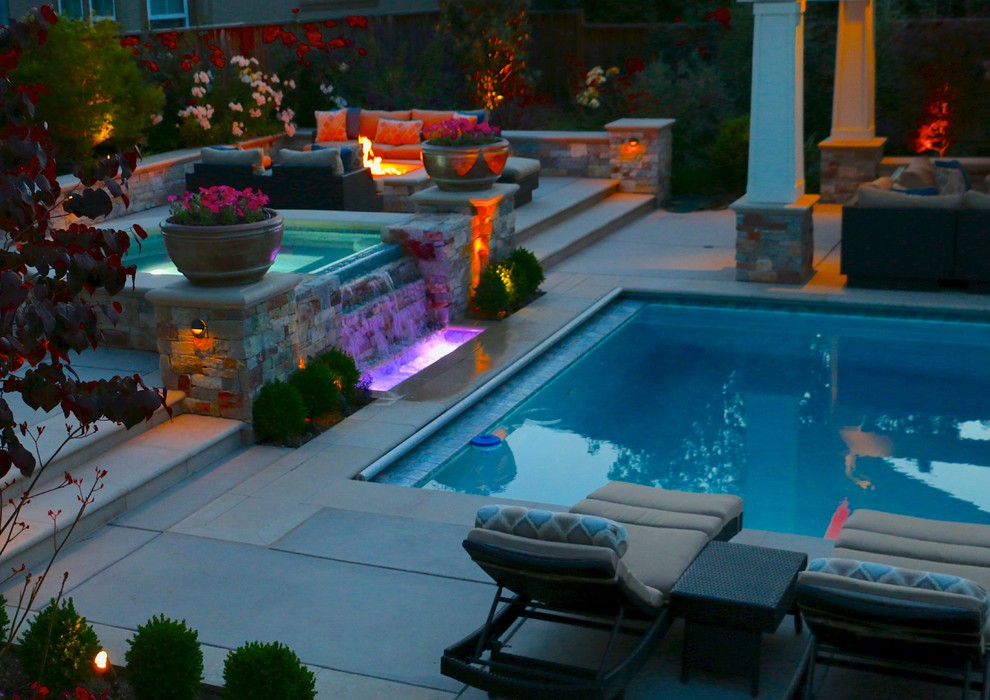 Example of a large classic backyard concrete paver pool design in San Francisco