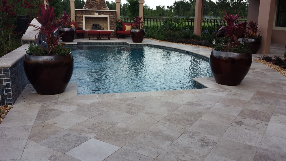 Photo of a mediterranean swimming pool in Tampa.