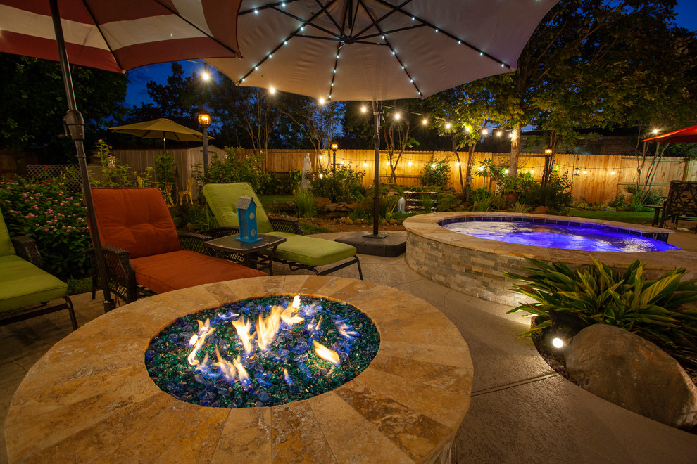 This is an example of a medium sized world-inspired back kidney-shaped swimming pool in Houston with decking.