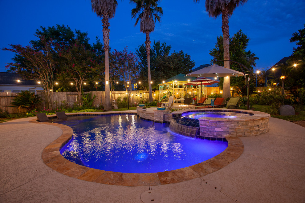Design ideas for a medium sized world-inspired back kidney-shaped swimming pool in Houston with decking.