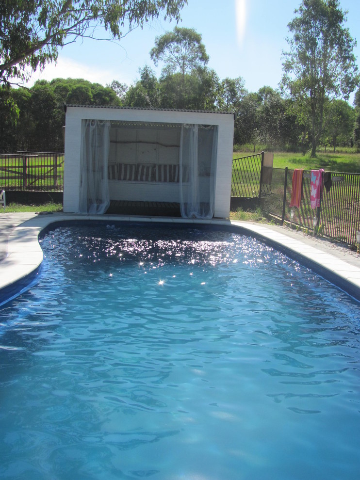 Example of an eclectic pool design in Other