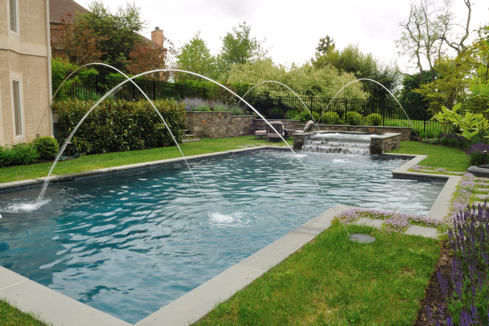 Inspiration for a large rustic backyard stone and custom-shaped natural pool fountain remodel in Philadelphia