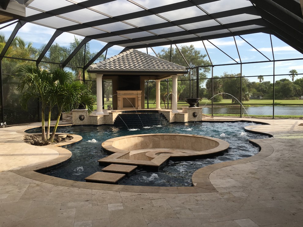 Photo of a large traditional natural swimming pool in Tampa.