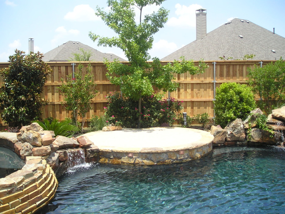 Inspiration for a mediterranean natural swimming pool in Dallas.