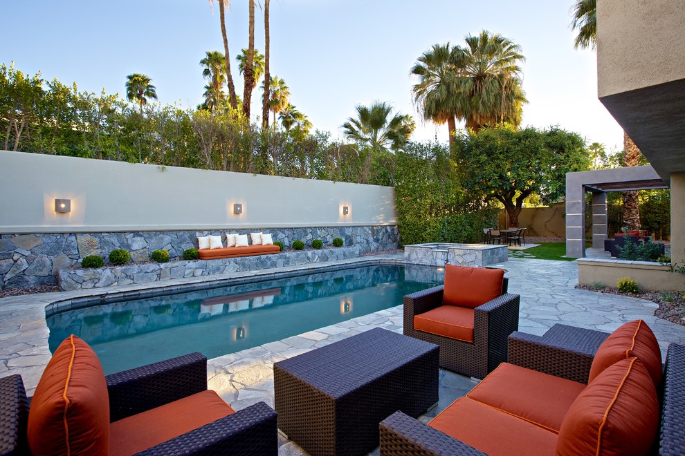 Pool - contemporary backyard stone pool idea in Los Angeles