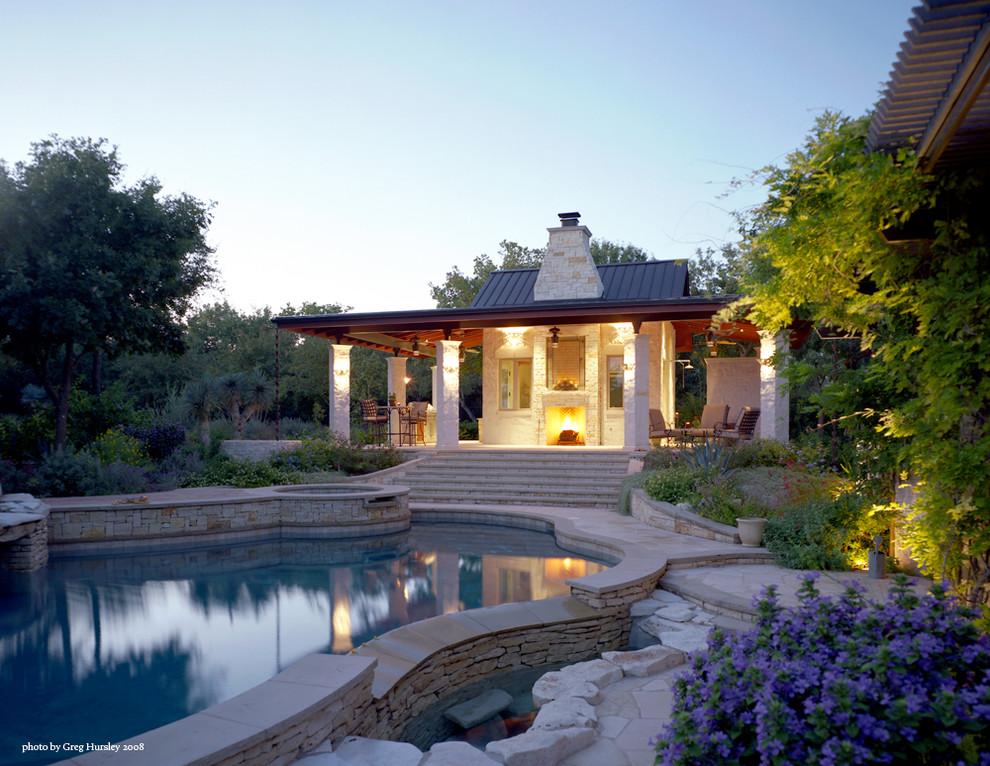 This is an example of a contemporary swimming pool in Austin with a pool house.