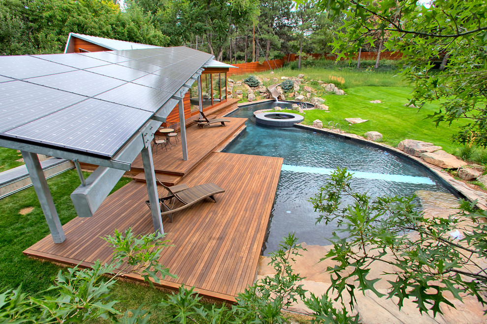 Design ideas for a medium sized contemporary back custom shaped above ground hot tub in Denver with stamped concrete.