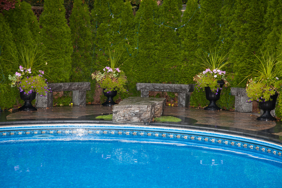 Pool - traditional backyard pool idea in Toronto