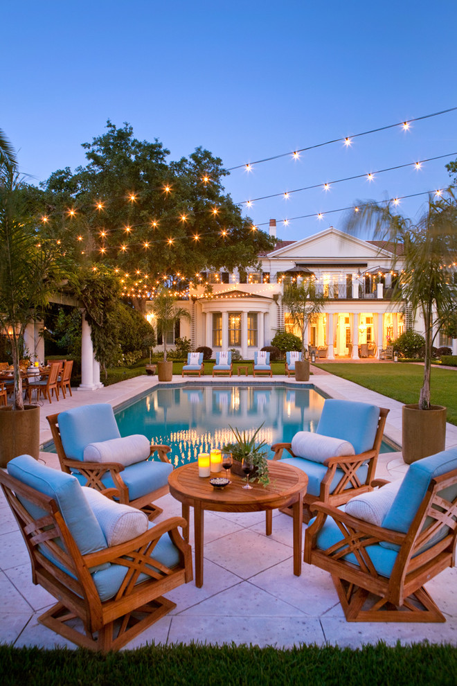 Elegant backyard rectangular and concrete paver pool photo in Orlando