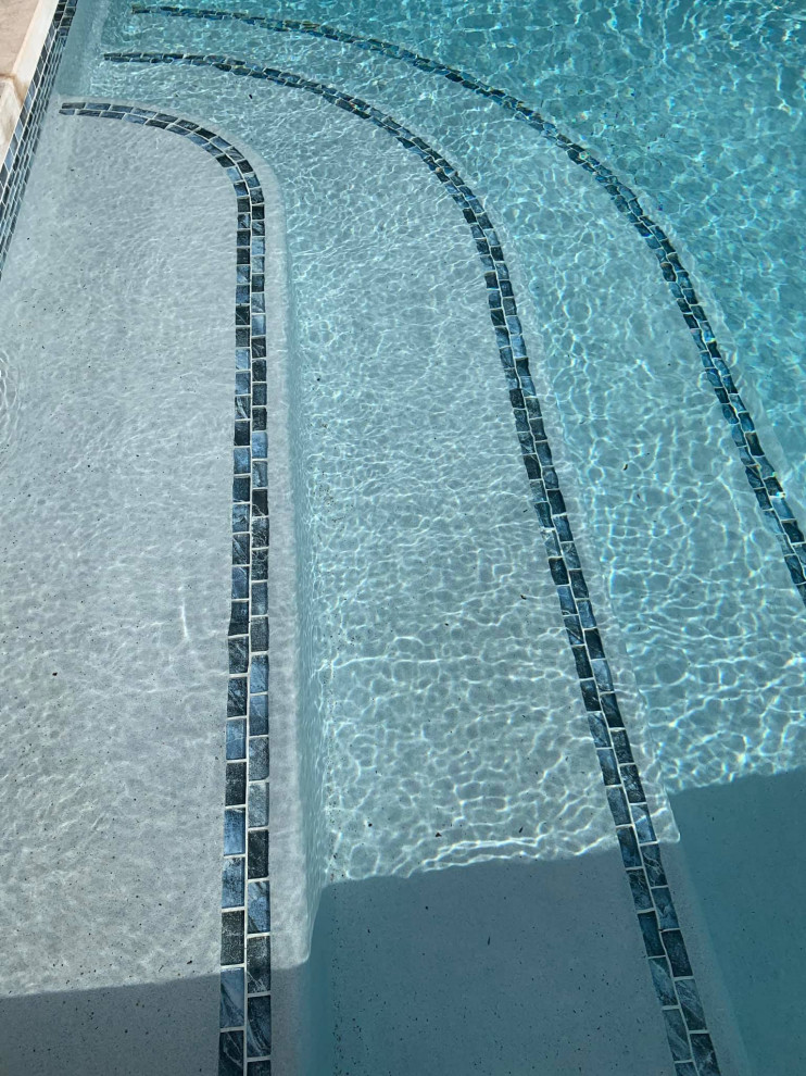 Pool Steps with glass tile decoration Modern Pool Birmingham by