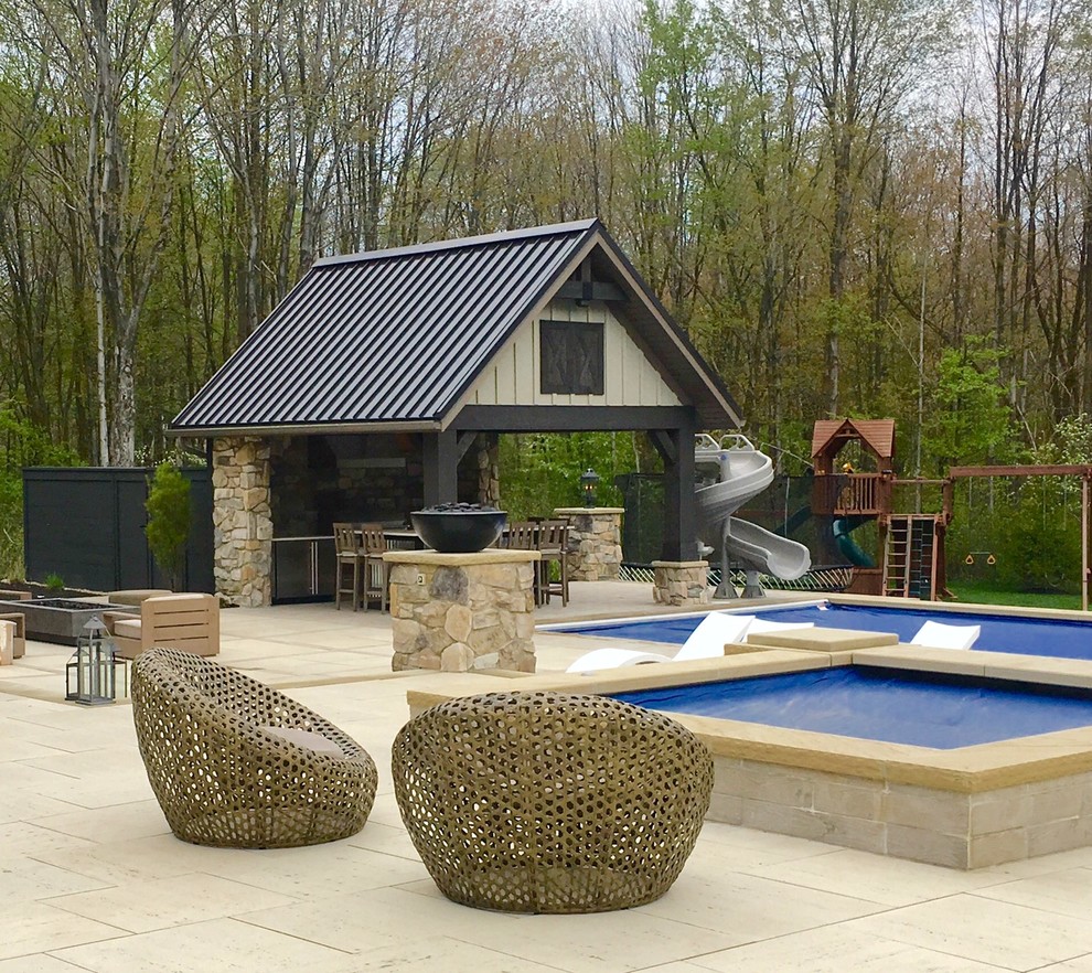Inspiration for an urban back swimming pool in Cleveland with a pool house.