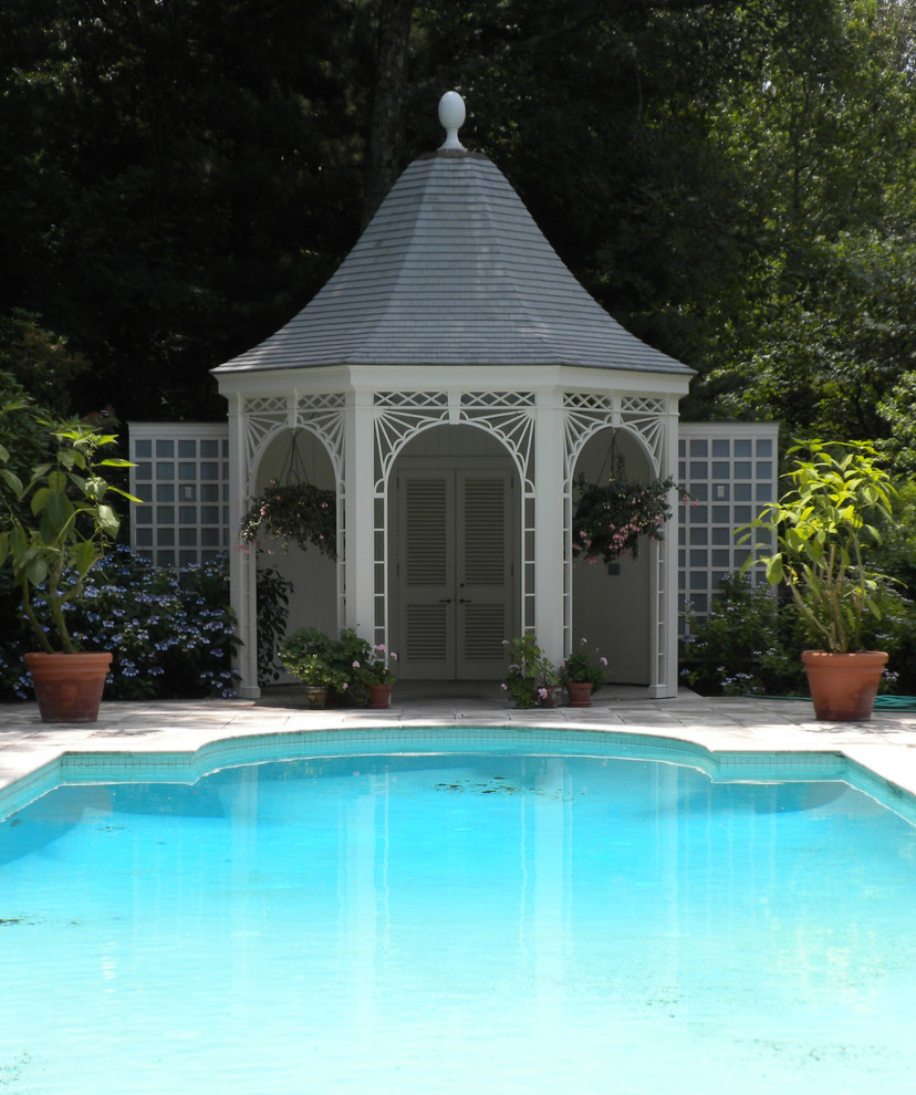 Inspiration for a timeless custom-shaped pool house remodel in Other