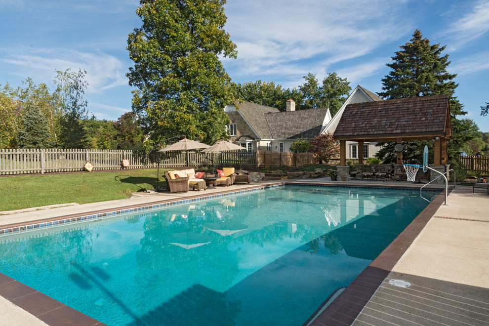 Design ideas for a traditional swimming pool in Cleveland.