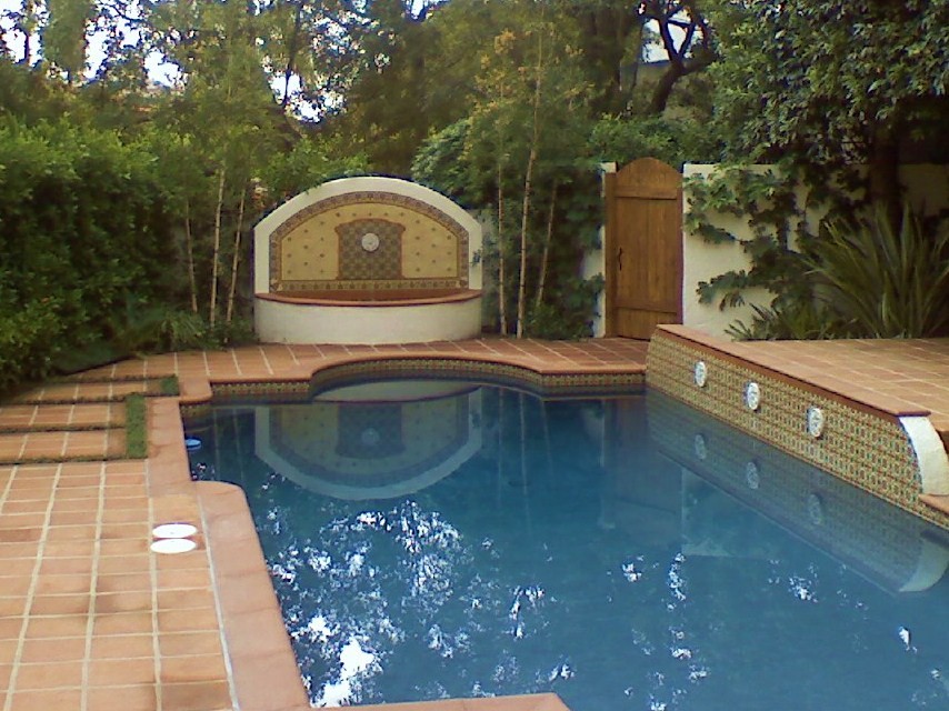 Inspiration for a large backyard rectangular pool fountain remodel in Los Angeles