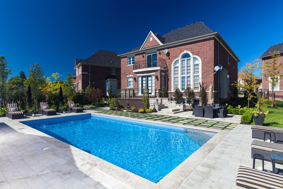 Photo of a contemporary back rectangular lengths swimming pool in Toronto.