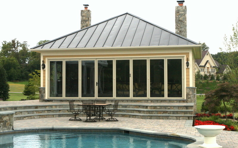 Large classic back custom shaped swimming pool in DC Metro with concrete paving.