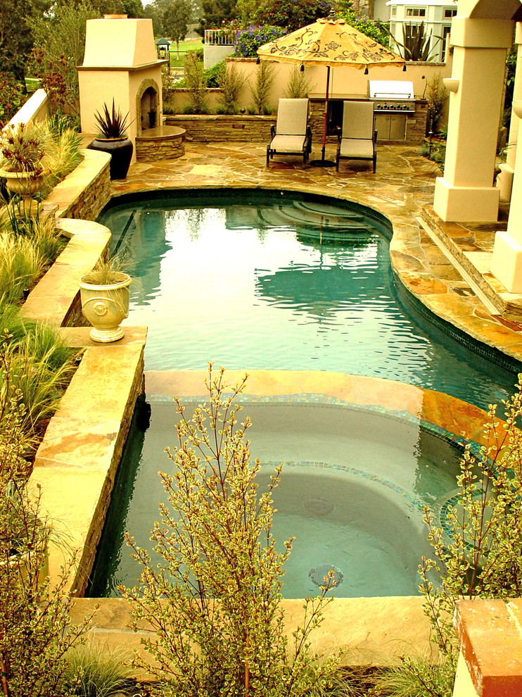 Photo of a mediterranean swimming pool in Orange County.