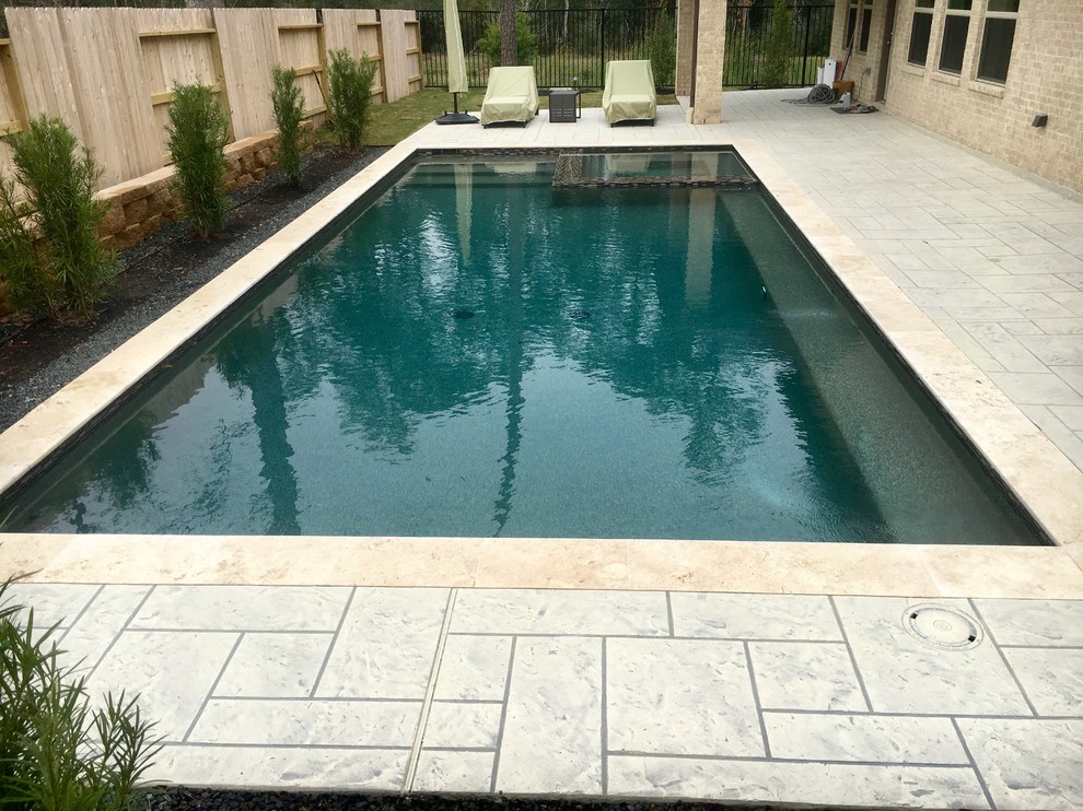 Inspiration for a mid-sized transitional backyard concrete and rectangular lap hot tub remodel in Houston