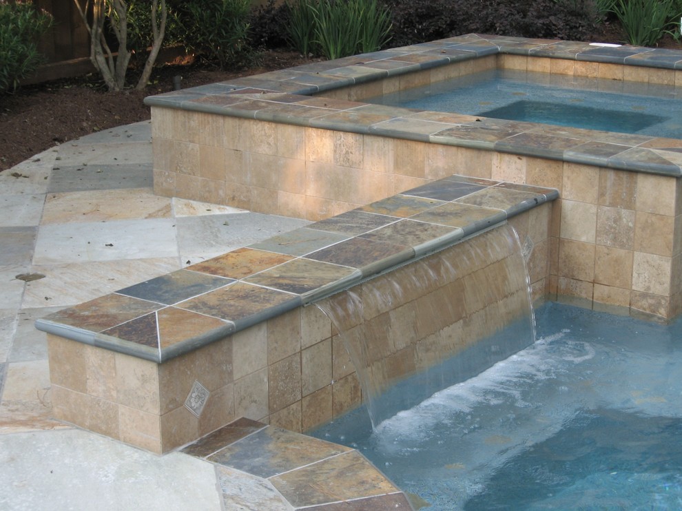 Design ideas for a medium sized classic back lengths swimming pool in Houston with a water feature and tiled flooring.
