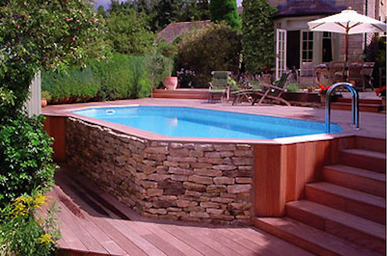 Inspiration for a mid-sized backyard round natural pool remodel in Providence