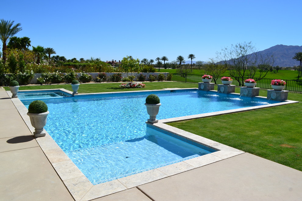 Diseño de piscinas y jacuzzis exóticos grandes a medida en patio trasero con adoquines de piedra natural