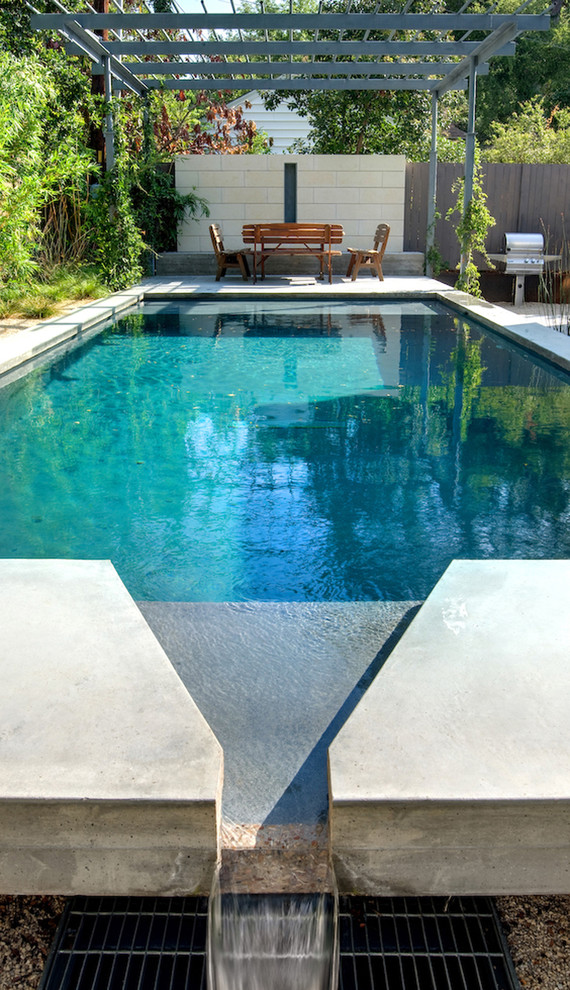 Elegant rectangular pool photo in Austin