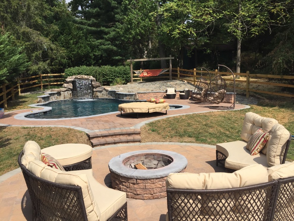 Precision Pool with Grotto, fire pit, tanning ledge & floating table