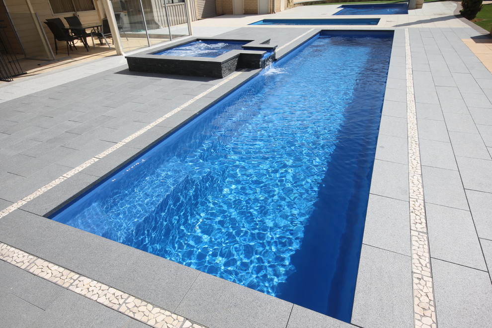 Pool - large contemporary backyard rectangular lap pool idea in Perth