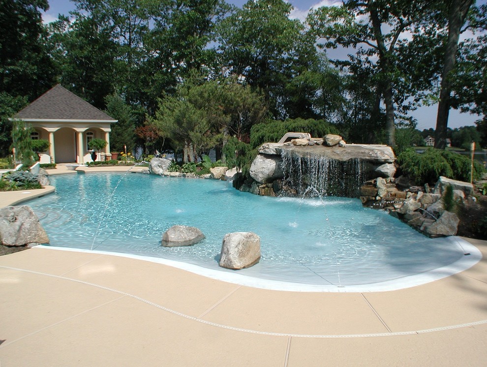 Inspiration for a large mediterranean backyard custom-shaped natural hot tub remodel in New York