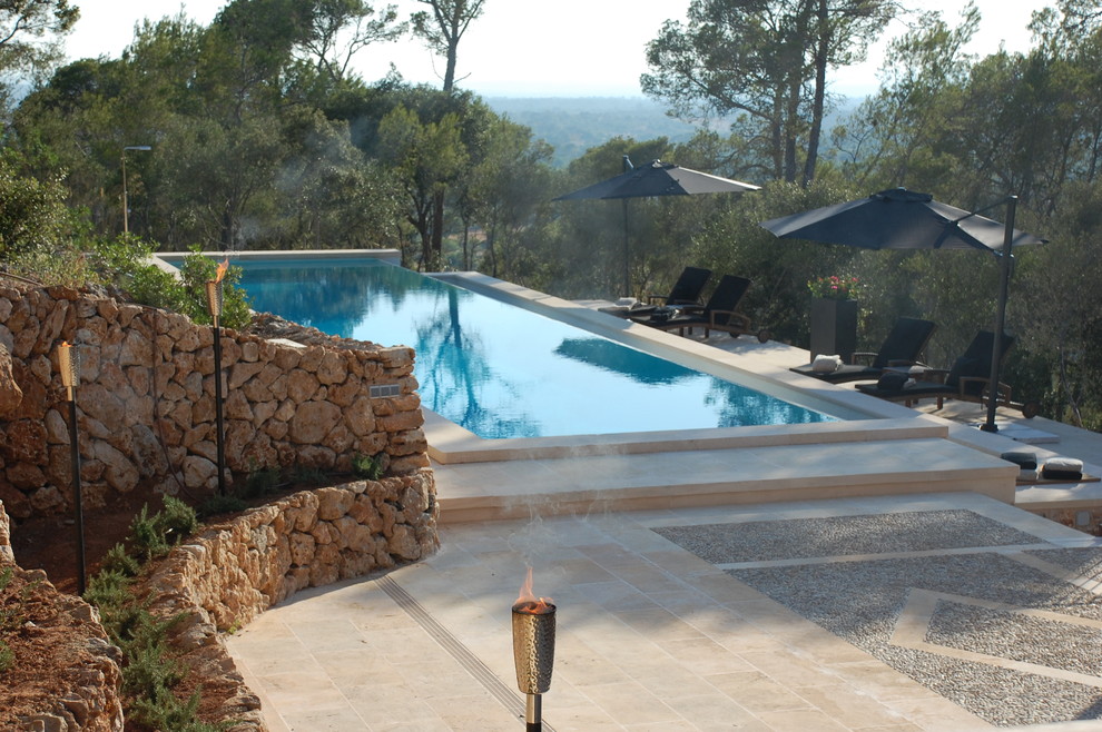 This is an example of a mediterranean swimming pool in Other.