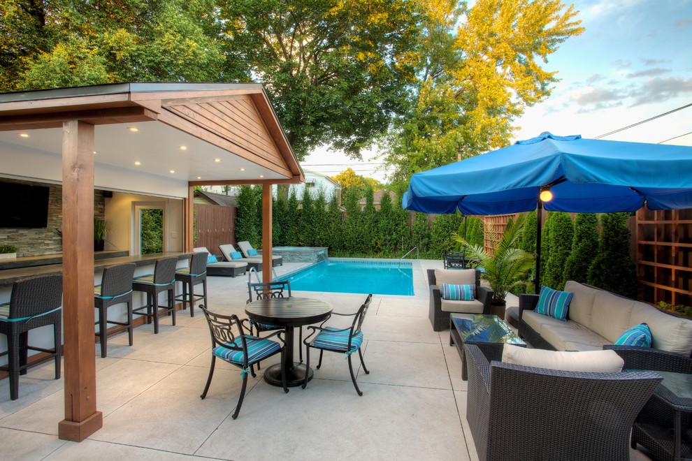 Inspiration for a timeless rectangular pool remodel in Toronto