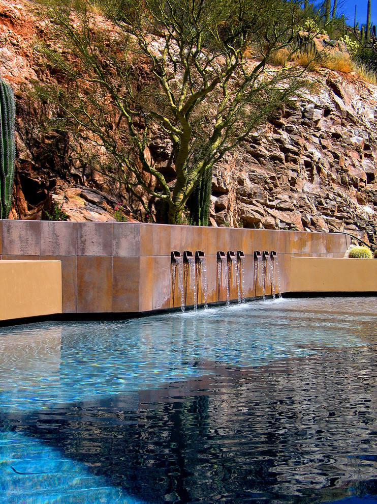 Источник вдохновения для домашнего уюта: бассейн произвольной формы в стиле фьюжн с фонтаном