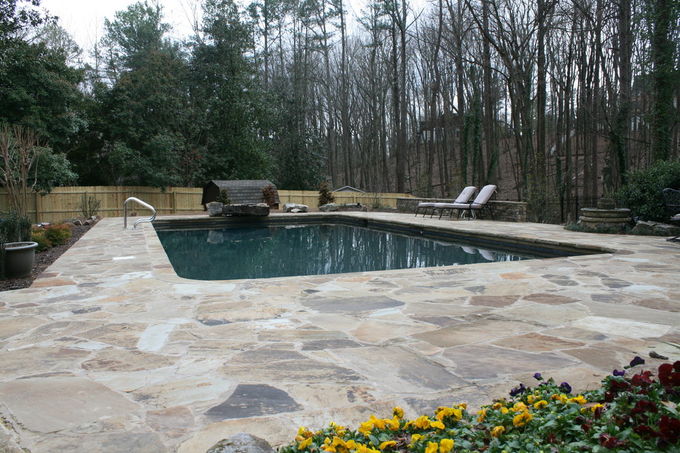 Inspiration for a large timeless backyard stone and rectangular natural pool remodel in Atlanta