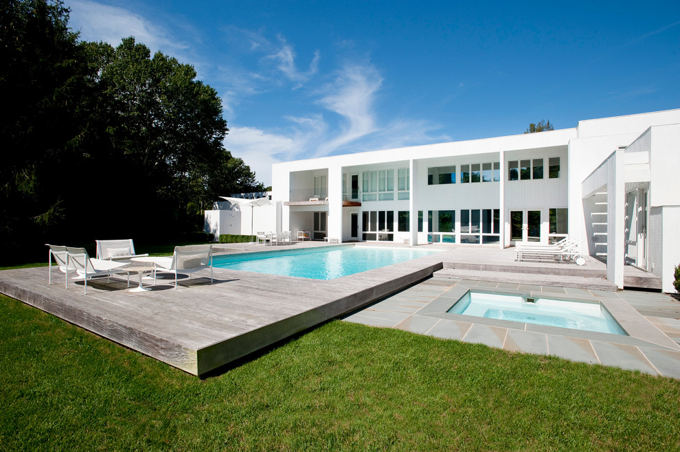 Minimalist pool photo in New York with decking