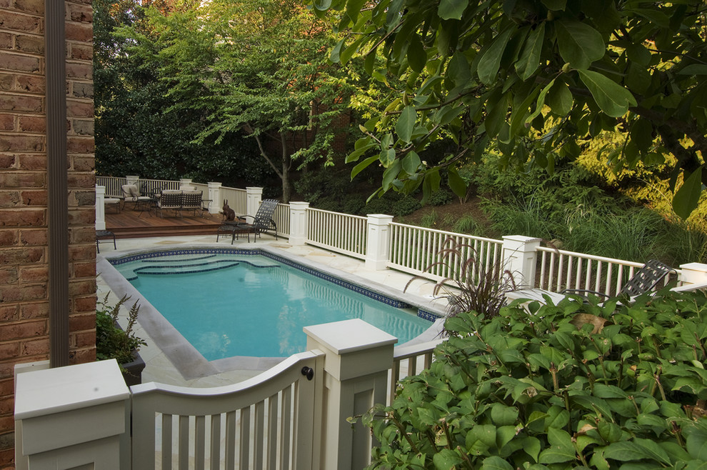 Inspiration for a mid-sized transitional backyard stone and rectangular pool remodel in DC Metro