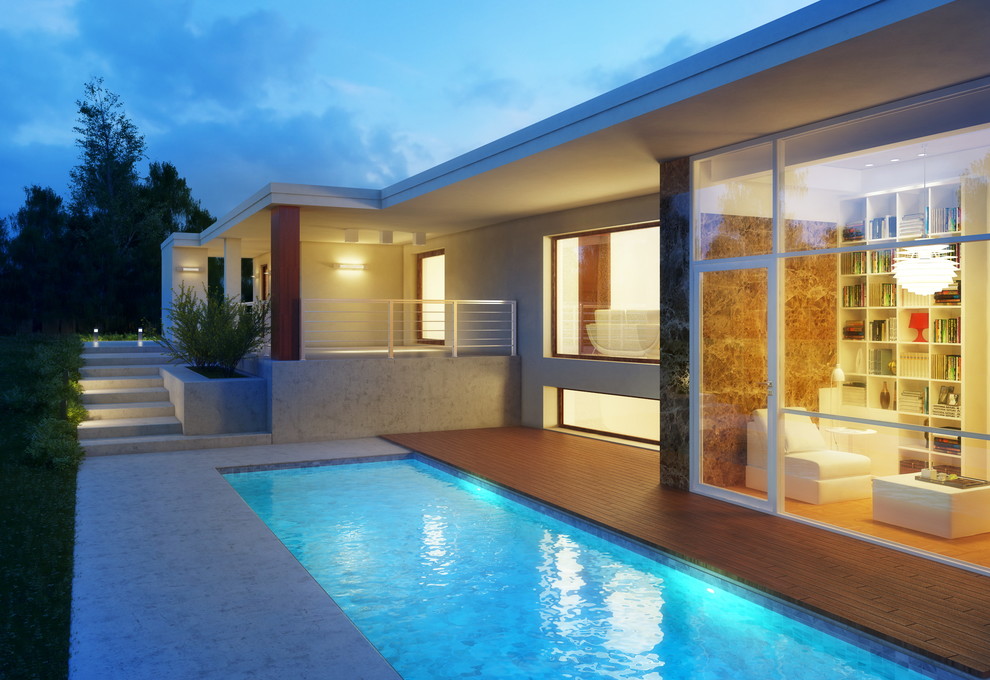 Idee per una piscina fuori terra minimalista rettangolare di medie dimensioni e davanti casa con una dépendance a bordo piscina