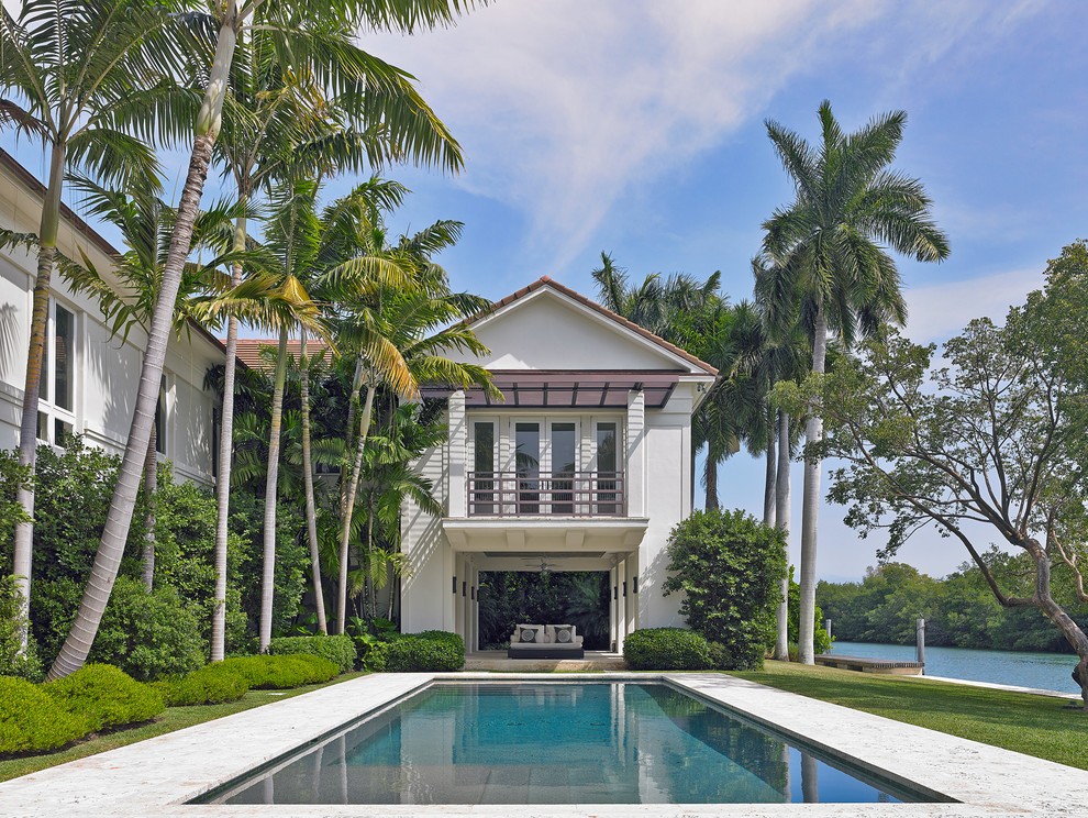 This is an example of a mediterranean rectangular swimming pool in Miami.