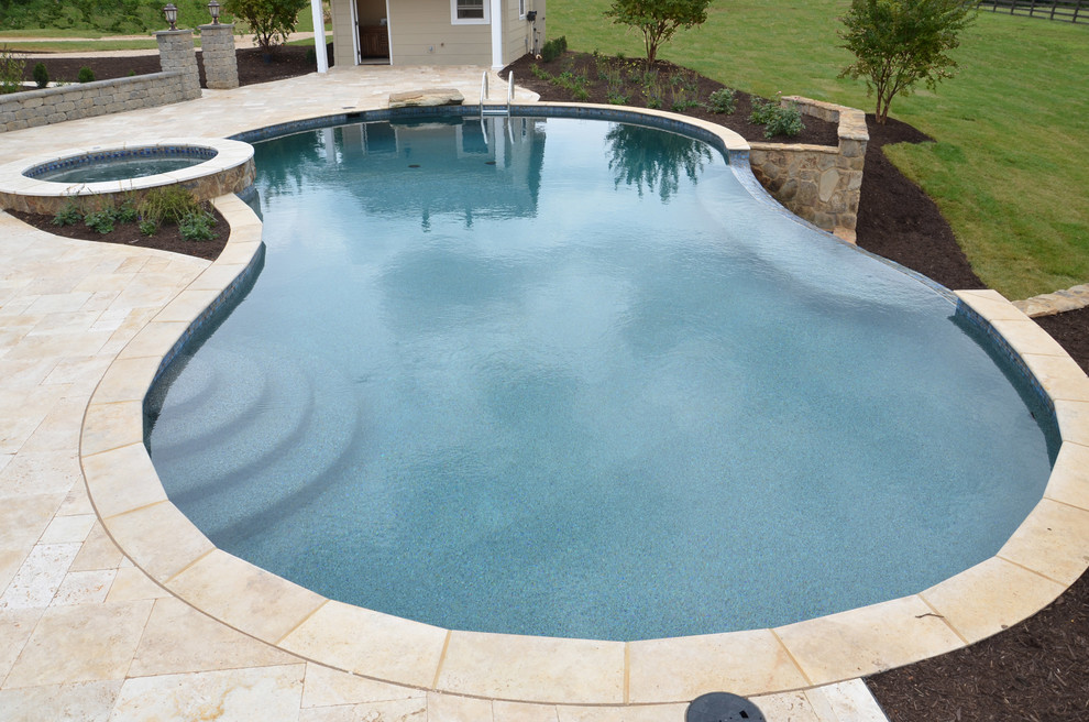 Inspiration for a timeless custom-shaped pool fountain remodel in New Orleans