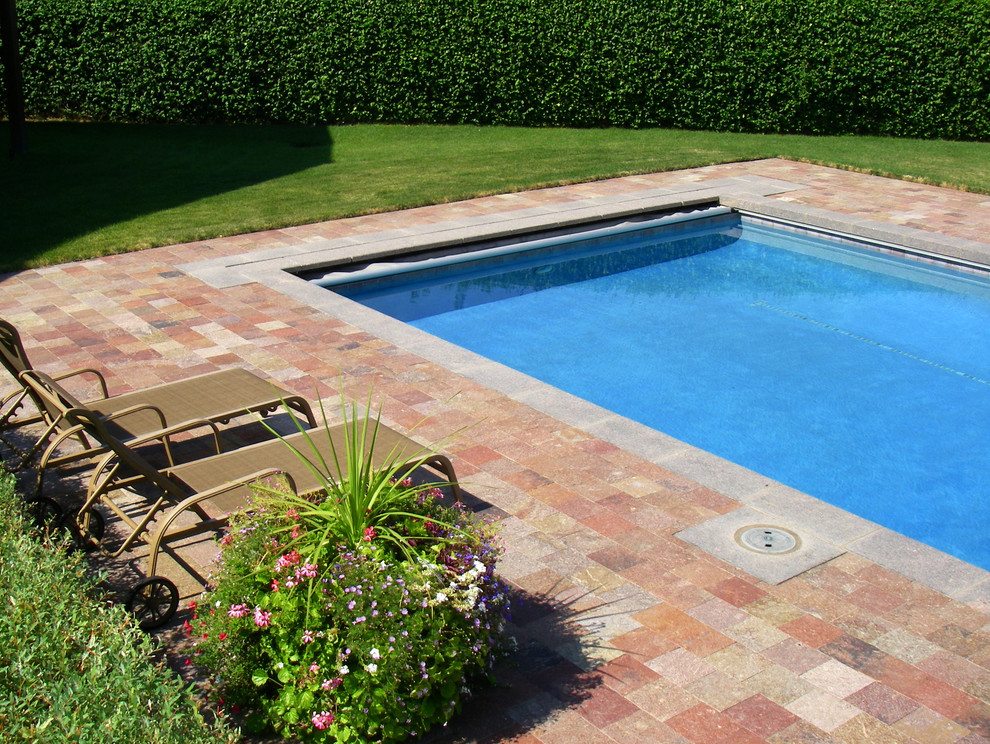 Photo of a medium sized classic back rectangular lengths swimming pool in Salt Lake City with a pool house and tiled flooring.