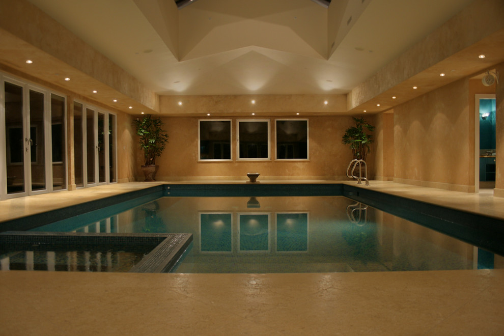 Photo of an expansive contemporary rectangular swimming pool in Vancouver with tiled flooring.