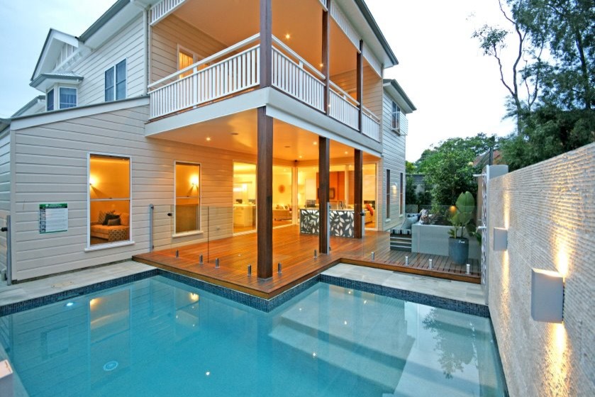 Inspiration for a small contemporary back l-shaped swimming pool in Brisbane with decking.